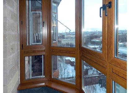 Французское остекление балкона профилем Veka с ламинированием под дерево в Дзержинском