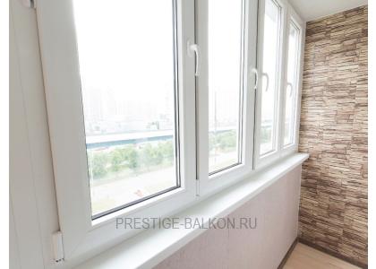 Тёплое остекление балкона профилем КВЕ и комбинированной отделкой пластиком и деревом в Дзержинском